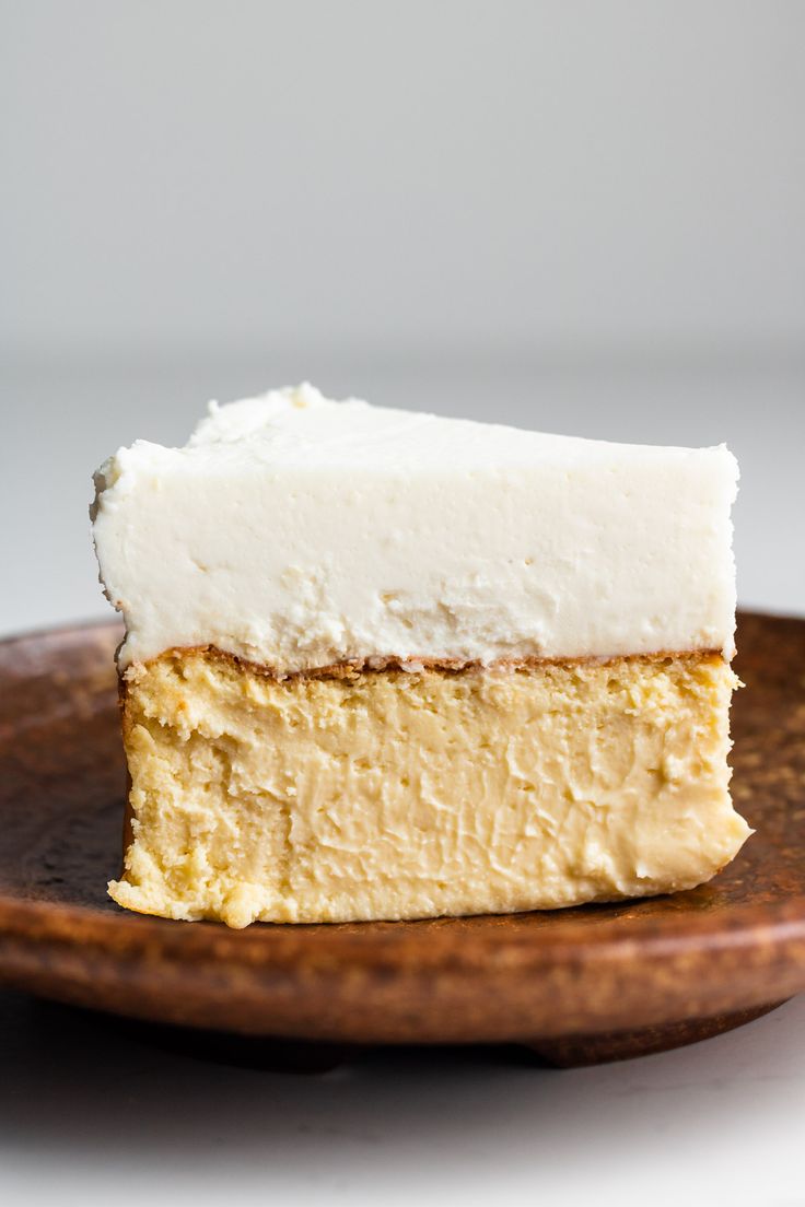 a piece of cake sitting on top of a wooden plate