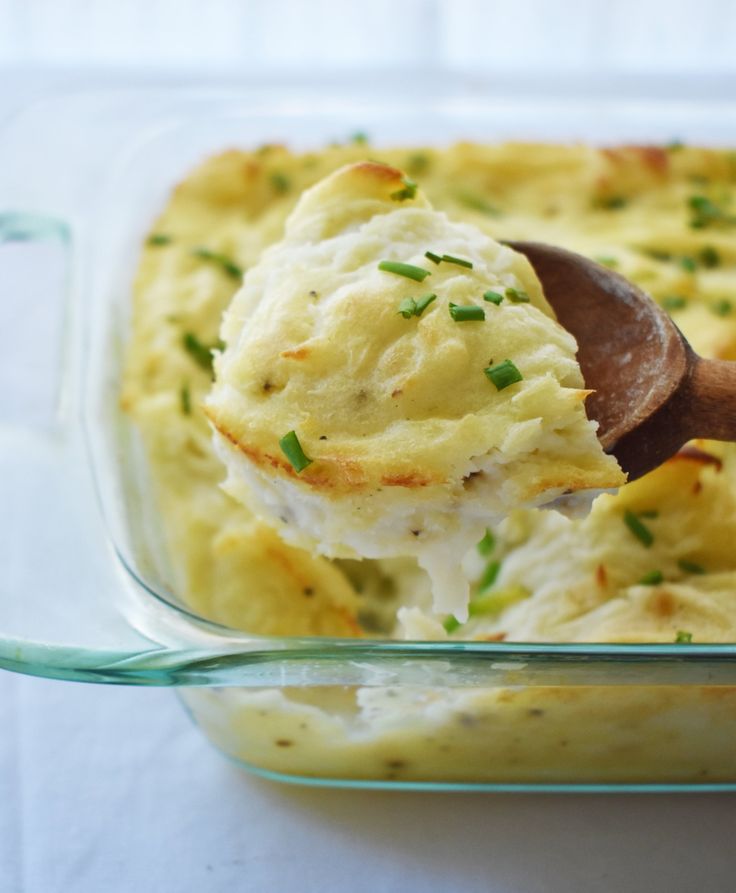 a spoonful of mashed potatoes in a casserole dish