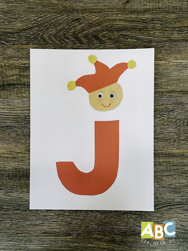 the letter j is for j with a clown's hat on top of it