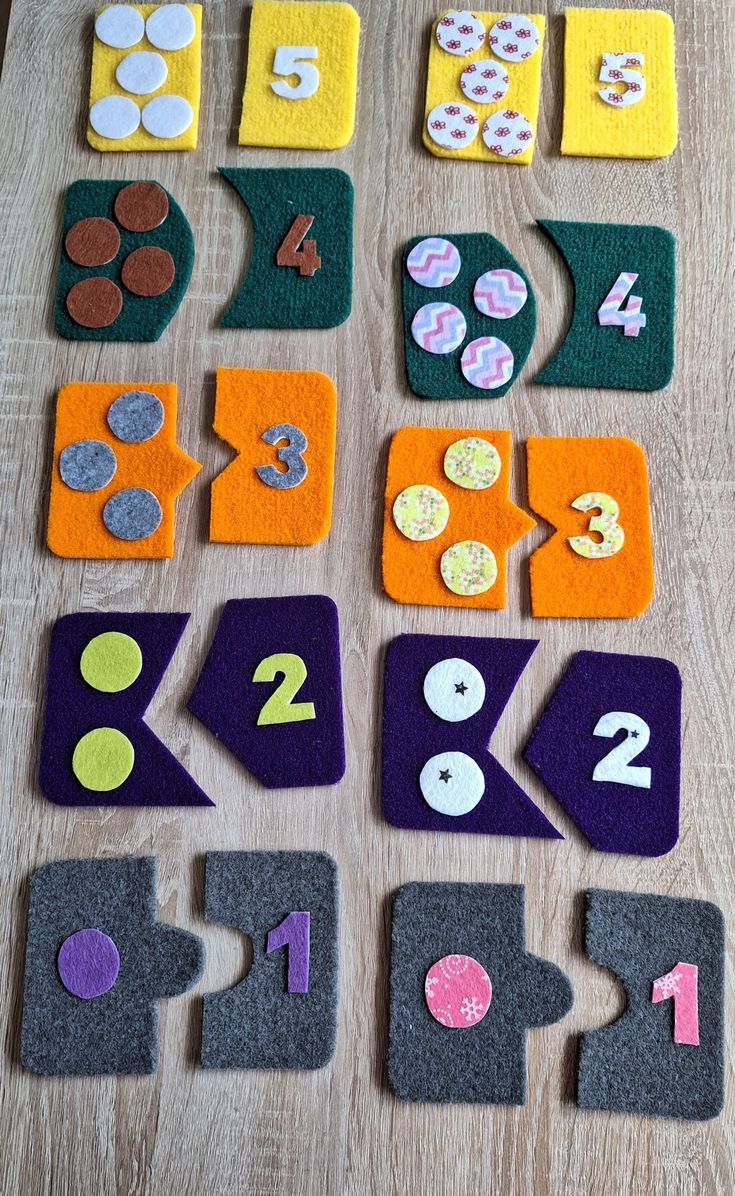 felt numbers and shapes laid out on a table