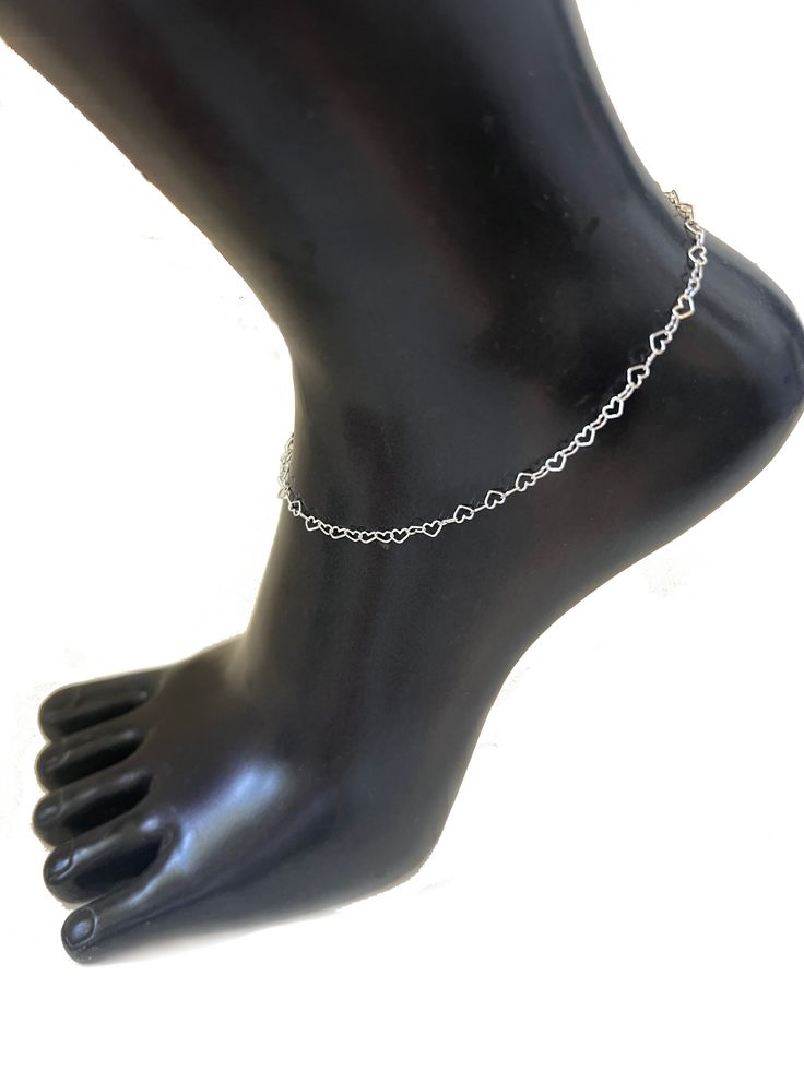 This heart chain anklet in sterling is the perfect accessory for any occasion. Crafted in classic .925 sterling silver, the sophisticated chain features delicate hearts for a stylish and timeless look. Perfect for any budget, this anklet is sure to become a favorite. Measures 9 1/2" on a .925 sterling silver chain. Minimalist Sterling Silver Anklet With Adjustable Chain, Adjustable Sterling Silver Anklet, Silver Hypoallergenic Heart Bracelet, Silver Anklet With Delicate Chain As Gift, Silver Delicate Chain Anklet As Gift, Silver Delicate Chain Anklet For Gift, Delicate Silver Anklet As A Gift, Dainty Sterling Silver Anklets, Sterling Silver Anklets With Silver Chain As Gift