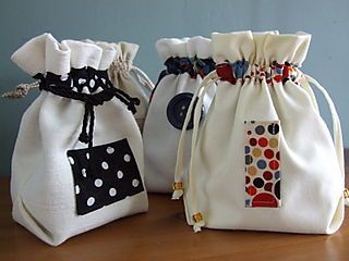 two bags with different designs on them sitting on a table