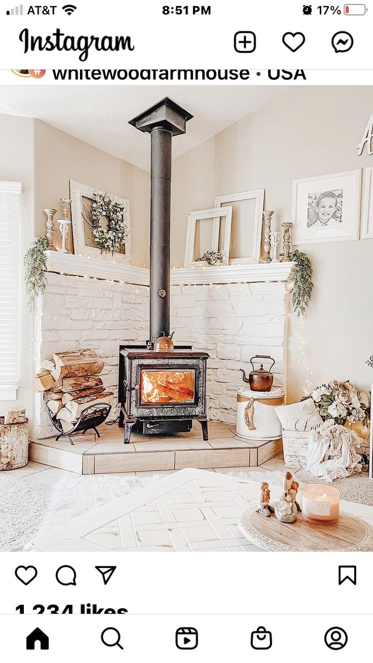 an instagram page with a wood burning stove in the middle and pictures on the wall