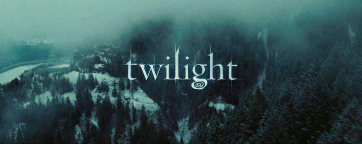 the logo for twilight is shown on top of a snowy mountain with trees in the foreground