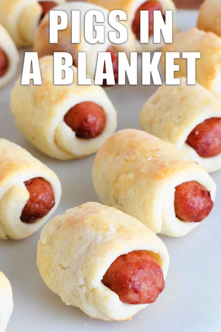 pigs in a blanket on a plate with text overlay that reads pigs in a blanket