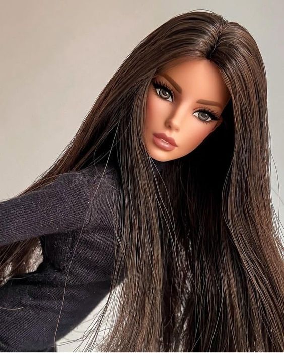 a close up of a doll with long hair