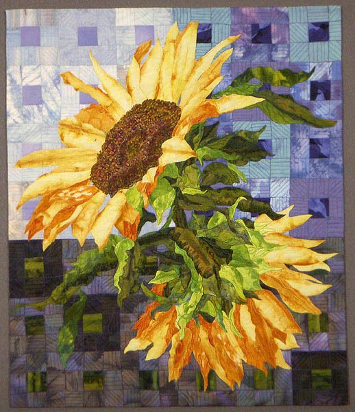 a painting of a yellow sunflower on a blue and white checkered background with green leaves