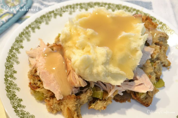 mashed potatoes, meat and gravy on a green and white floral plate