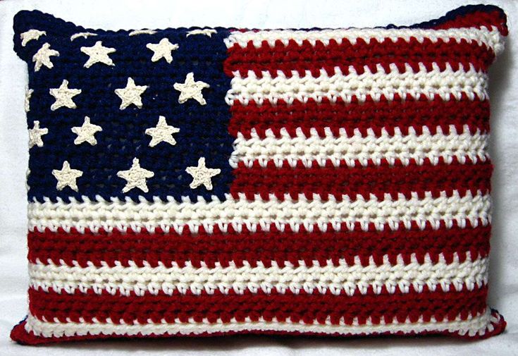 an american flag crocheted pillow is shown