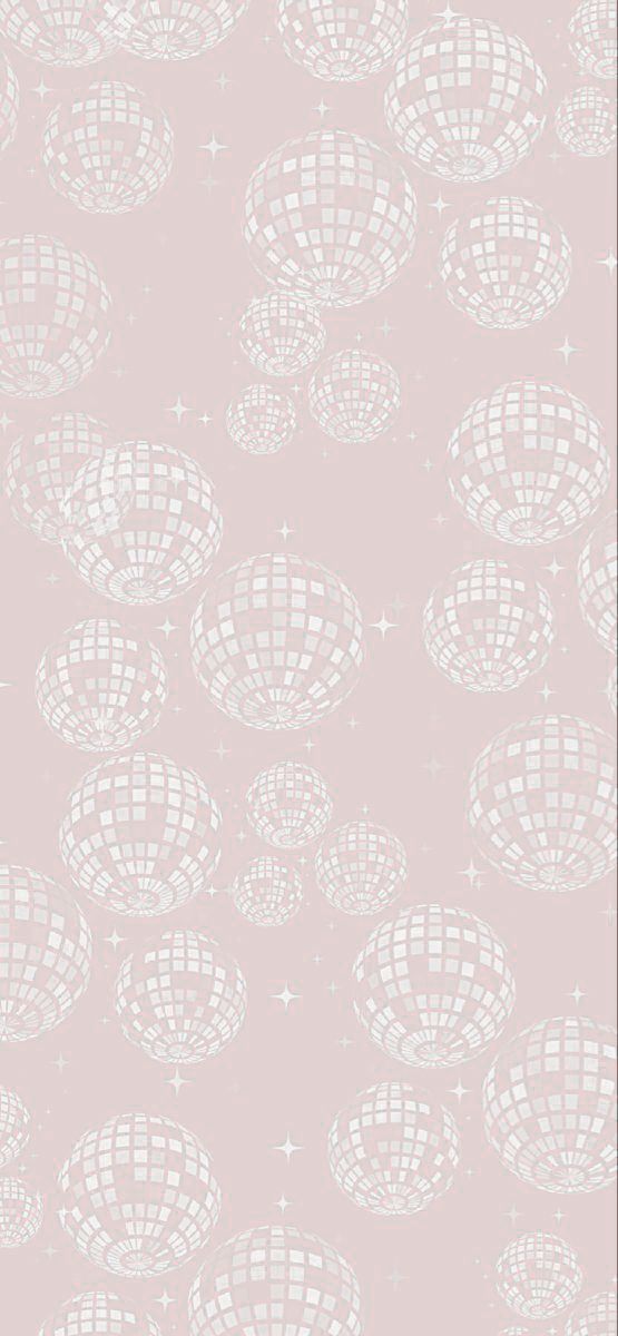 a pink wallpaper with white circles and stars on the bottom, in front of a gray background