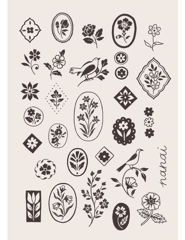 an assortment of flowers and birds in black ink