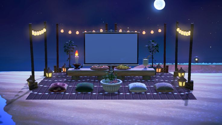 an outdoor movie screen set up in the middle of a snow covered field at night