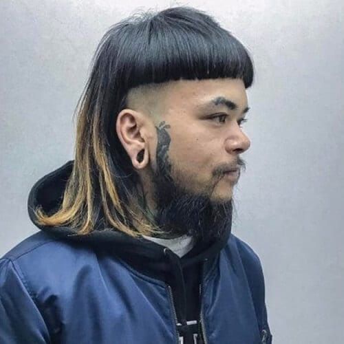 a man with long hair and a goatee is shown in this mugshot photo