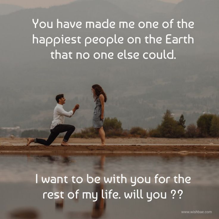 a man kneeling down next to a woman in front of a lake with the caption you have made me one of the happpiest people on the earth that no one else could