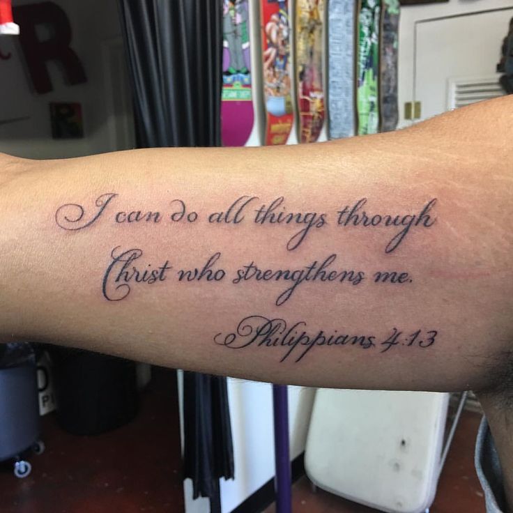 a person with a tattoo on their arm saying i can do all things through christ who straightens me