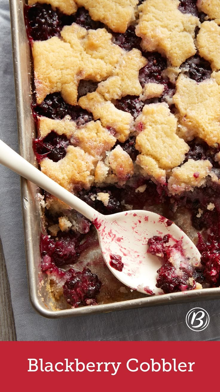 blueberry cobbler in a baking pan with a spoon on the side and text overlay that reads, blackberry cobbler