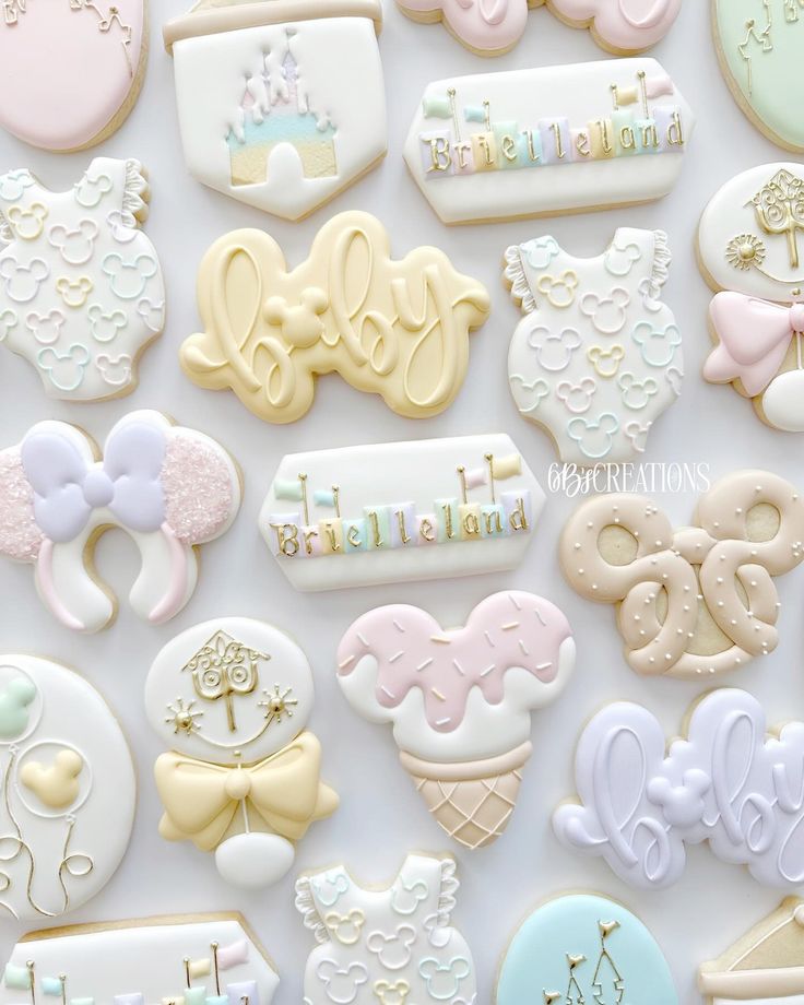 many decorated cookies are displayed on a white surface