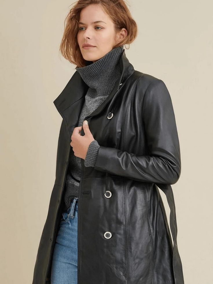 Women's Plain Leather Coat In Black Elevate your style with the women's plain leather coat. Crafted from real sheepskin with a semi-aniline finish, it features a faux shearling inner shell, a chic belted waist, button closure, and a sophisticated turtle neck collar. With practical details including two side pockets and one inside pocket, all in timeless black. Outer Shell: Real Leather Leather Type: Sheepskin Leather Finish: Semi-aniline Inner Shell: Faux Shearling Feature: Belted Waist Closure Sleek Long Leather Coat, Soft Leather Outerwear For Winter Workwear, Soft Leather Winter Outerwear For Work, Soft Leather Outerwear For Winter Professional Wear, Leather Long Coat For Fall, Winter Soft Leather Outerwear, Black Leather-lined Winter Outerwear, Black Leather Lined Winter Outerwear, Sleek Leather Jacket For Winter