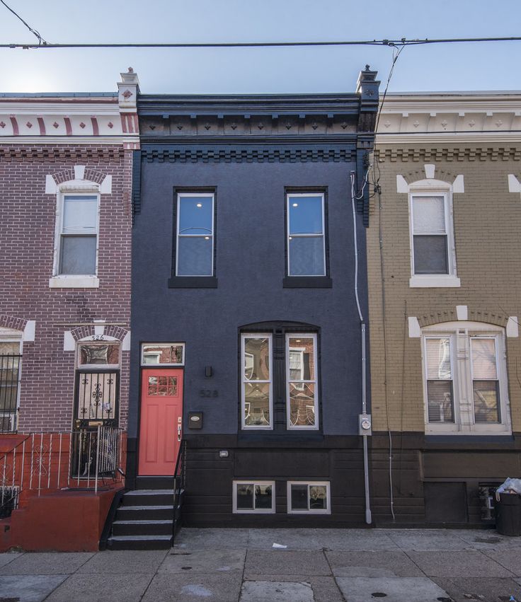 the front of two buildings with stairs leading up to them