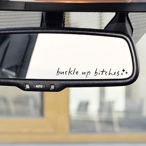 the side view mirror on a vehicle with words written on it and an image of a building in the rear view mirror