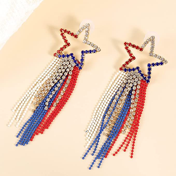 two red, white and blue beaded stars are hanging from the back of earrings