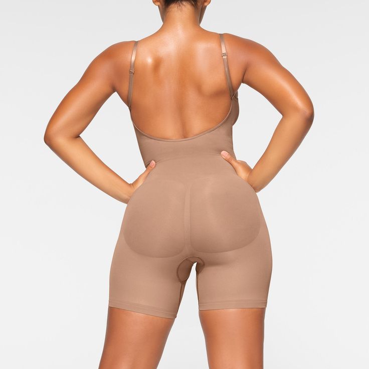 A sculpting bodysuit that sculpts silhouette, cinches waist, and smooth thighs while providing support and lift for your curves. Featuring a deep scoop back that makes it the perfect backless shapewear option. | SKIMS Low Back Mid Thigh Bodysuit | Medium Neutral | Seamless Sculpt Backless Shapewear, Backless Body Shaper, Sculpting Bodysuit, Backless Bodysuit, Body Shapers, Fall Shopping, Cinched Waist, Low Back, Shapewear