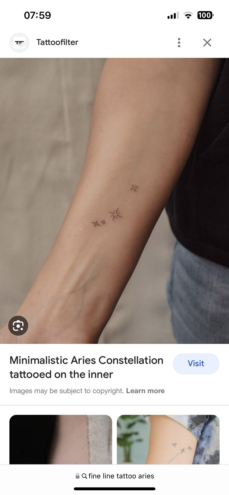 a woman's arm with small stars on it and the text minimalistic aris constellation tattooed on the inner wrist