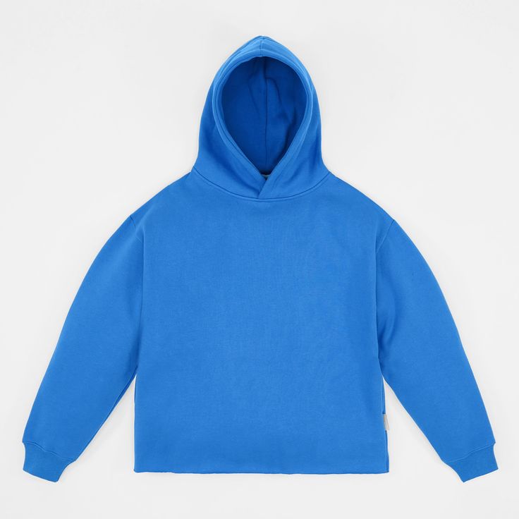 Experience ultimate comfort and warmth with our Monk Hue Blue Heavy Hoodie. Designed for those who appreciate a soft, loose-fitting style, this hoodie is ideal for layering before and after workouts or simply relaxing on a casual day. Made from a heavy-weight cotton/polyester blend, it offers the perfect balance of durability and softness. Featuring an oversized design and drop shoulder, this pullover hoodie ensures a relaxed fit that moves with you. The lack of ribbing on the waistband adds to Blue Sweatshirt With Kangaroo Pocket, Oversized Blue Hoodie For Streetwear, Comfy Blue Sweats With Ribbed Cuffs, Blue Fleece Sweatshirt For Loungewear, Solid Color Cozy Sports Hoodie, Cozy Solid Color Hoodie For Sports, Cozy Solid Hoodie For Sports, Cozy Fit Blue Sweatshirt With Ribbed Cuffs, Cozy Hoodie For Sports