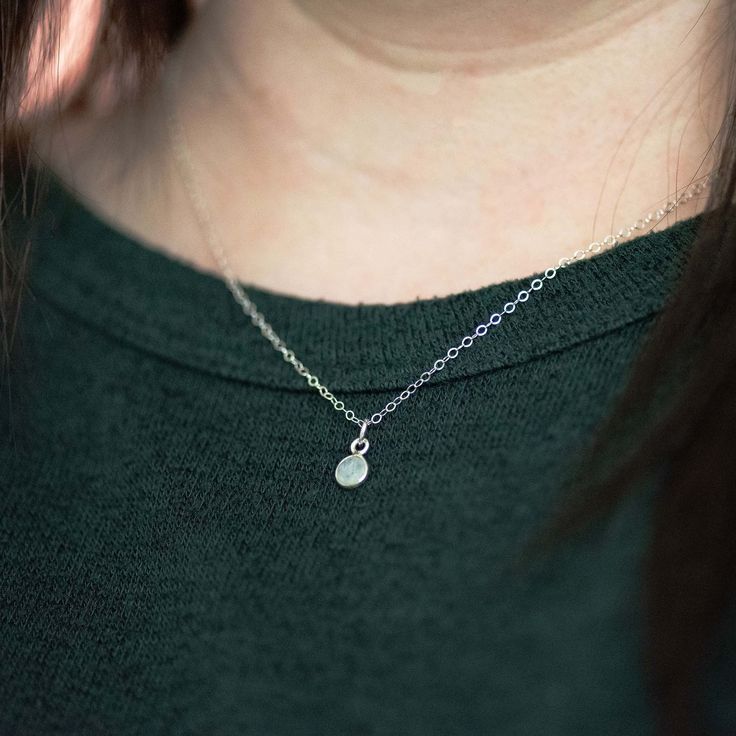 Step up your jewelry game with our charming Dainty Birthstone Pendant Necklace, the perfect accessory for women and teen girls. Lavishly crafted in classic sterling silver, this necklace is accented by a 6mm pendant, bezeled with the birthstone of your choice. It's an impressive piece of ornament that not only adds a splash of glam but is also a personal treasure. This pendant necklace is not just a charm, but a piece of loved ones carried close to the heart. Let it be a talisman of inspiration, a beacon of love, and a token of the beautiful journey of life gifted by you. Size: choose desired necklace length with additional 2 inch extender, 6mm pendant width Materials: desired birthstone gemstone of your choice Metal: sterling silver pendant, chain and components Everyday Hypoallergenic Charm Necklaces, Dainty Everyday Birthstone Necklace, Minimalist Birthstone Charm Necklace, Adjustable Sterling Silver Pendant Drop Necklace, Dainty Birthstone Necklace As A Gift For Her, Dainty Birthstone Necklace Gift For Her, Dainty Adjustable Silver Necklace, Delicate Chain Necklace For May Birthstone, Silver Necklace For Everyday With May Birthstone