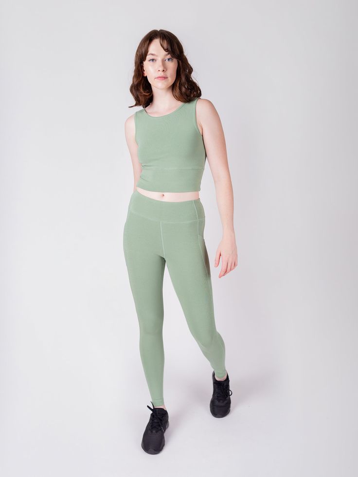 In a world of polyester and nylon, we're breaking the trend with our eco-conscious performance fabric crafted from ribbed organic cotton. In Sage green. Structured support where you want it, stretchy comfort where you need it. You'll seriously want to wear these every day.• Creamy soft feel and sleek fit• 4-way stretch + sweat-wicking• Soft and breathable natural fibers• Low-impact, non-toxic dyes• Stretchy side pockets!• Ribbed, supportive structure Michaela is 5'9" and wearing a size S.Aziza i Everyday Activewear In Recycled Polyester, Everyday Solid Activewear In Recycled Polyester, Everyday Fitted Activewear With Light Support, Versatile High Stretch Activewear For Everyday, Versatile Compressive Green Yoga Pants, Everyday Stretch Activewear In Recycled Polyester, Versatile Compressive Activewear For Everyday, Versatile Compressive Activewear, High Stretch Green Yoga Pants For Loungewear