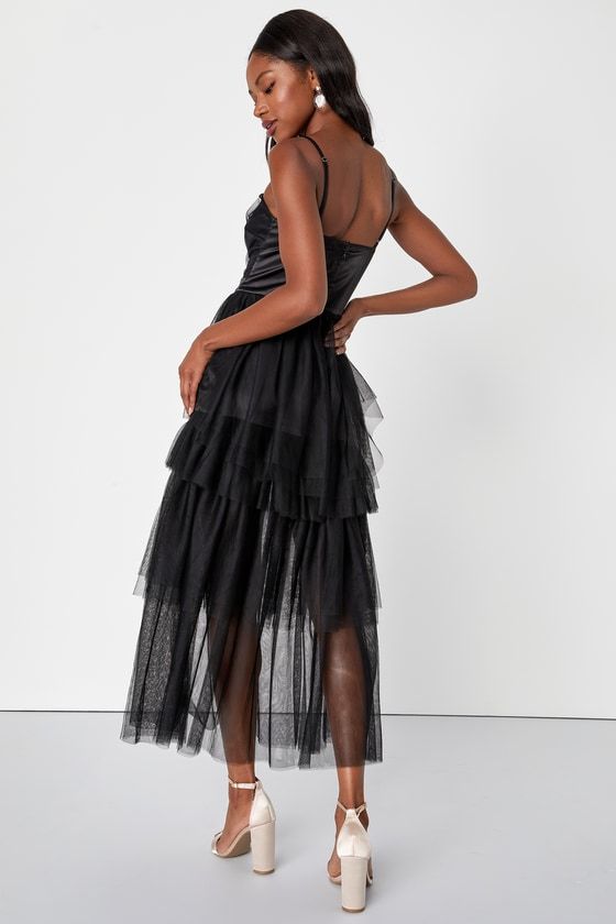 Bring a flirtatious flair to any event with the Lulus Sultry Sweetness Black Tiered Tulle Maxi Dress! Airy woven tulle shapes this breathtaking dress that has adjustable spaghetti straps and a darted bodice with a straight neckline and a banded satin waist. Skirt has tiers of lightweight tulle that falls to a sheer maxi hem. Hidden zipper/clasp at back. Fit: This garment fits true to size. Length: Ankle length. Size medium measures 45.50" from adjustable straps to hem. Bust: Great for any cup si Sheer Spaghetti Strap Party Dress, Sheer Spaghetti Strap Dress For Evening, Sheer Spaghetti Strap Evening Dress, Sheer Dress With Spaghetti Straps For Evening, Party Dresses With Sheer Spaghetti Straps, Sheer Evening Dress With Spaghetti Straps, Evening Dress With Sheer Spaghetti Straps, Sheer Mesh Dress With Spaghetti Straps For Party, Cocktail Dress With Corset Back And Tulle Material