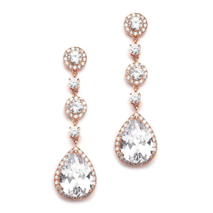 two pairs of earrings with white stones and diamonds on the bottom, one in rose gold