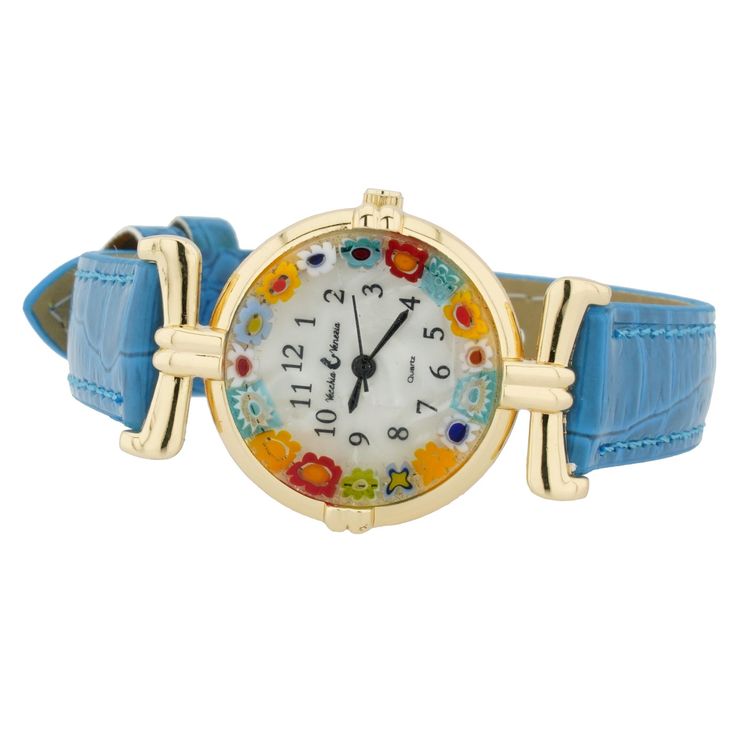 Looking for a timepiece that goes beyond the ordinary? Consider this exquisite Murano Glass Millefiori watch showcasing the finest craftsmanship and the renowned artistry of Murano glass-making. Murano Glass watches crafted by talented Italian artisans in Venice combine practicality and elegance for a truly unique and beautiful look. The vibrant Millefiori flowers adorning the face of this Murano watch will make every day more enjoyable. With every glance, you'll be transported to the enchanting Murano Glass Jewelry, Glass Making, Venetian Glass, Gold Light, Genuine Leather Bags, Elegant Accessories, Office Accessories, Blue And Gold, Glass Jewelry