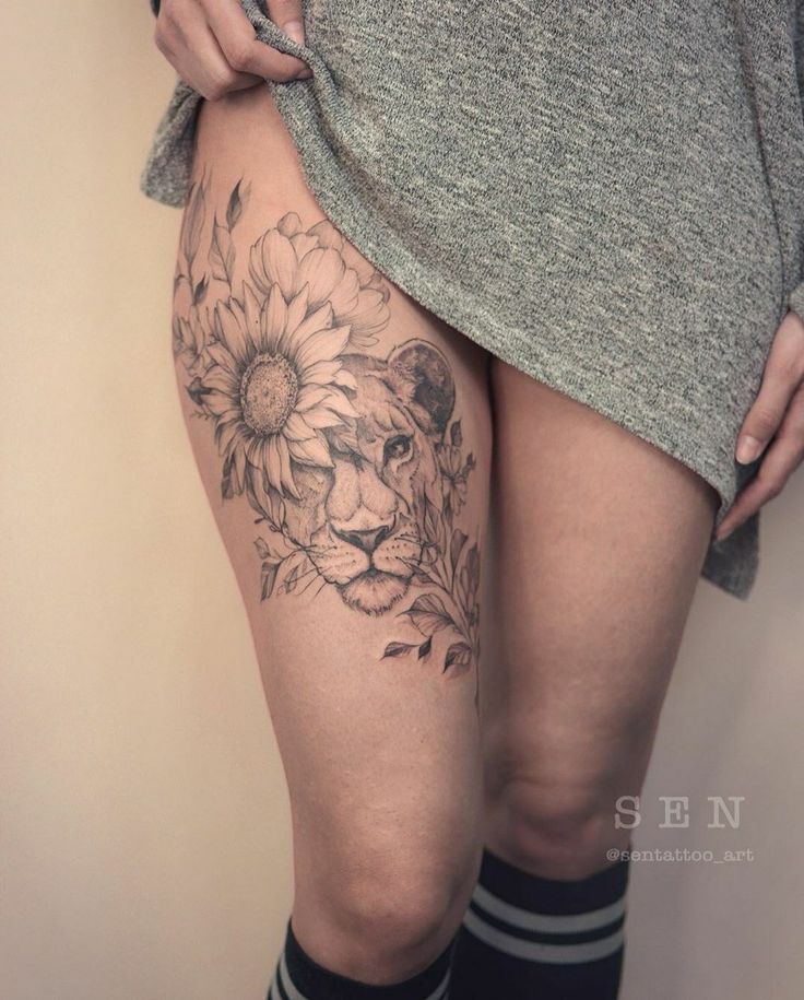 a woman's thigh with flowers on it