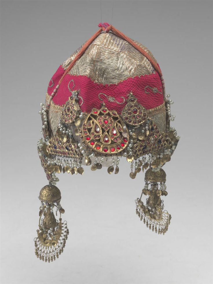 A fabulous Kashmiri hat with many silver and glass ornaments.  AMNH Kashmiri Jewellery Vintage, Kashmiri Jewellery, Kashmiri Culture, Mughal Jewelry, Vintage Indian Jewelry, Kundan Jewellery Bridal, Artificial Snow, American Museum Of Natural History, Bridal Purse