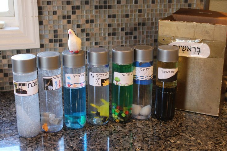 several bottles are lined up on the counter