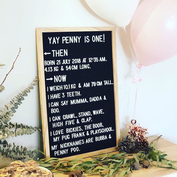 there is a sign on the table that says yay penny is one then now