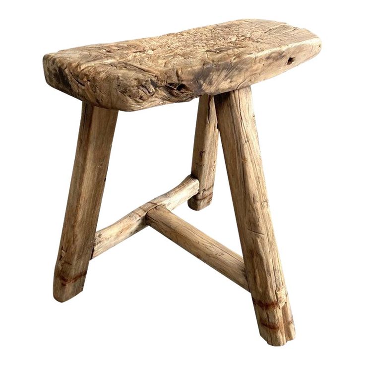 a wooden stool made out of logs on a white background