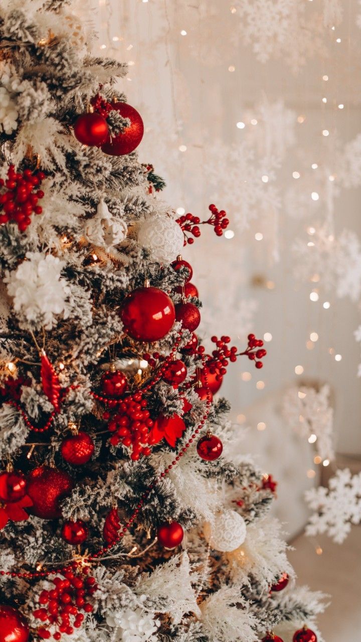 a decorated christmas tree with red and white ornaments