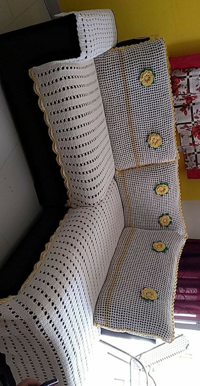 a chair that is sitting in front of a window with buttons on the back of it