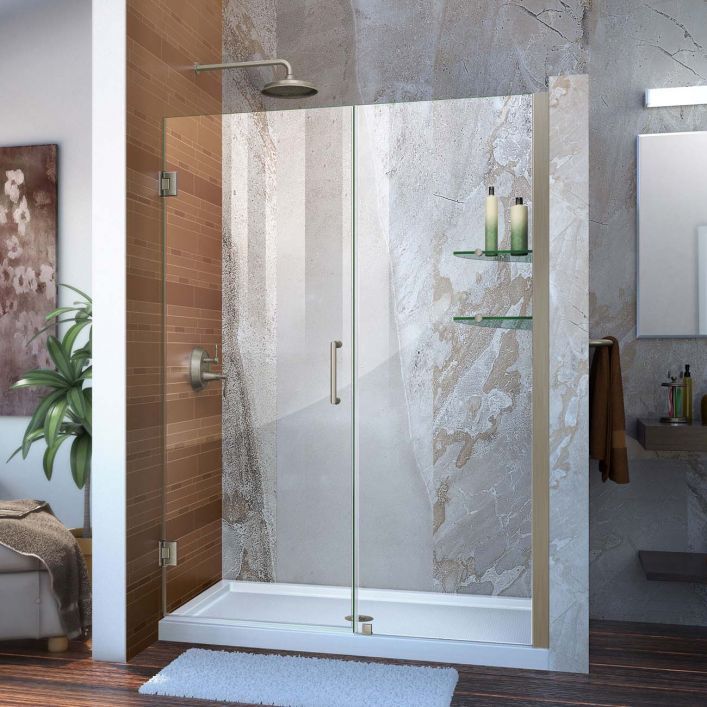 a bathroom scene with focus on the shower and bathtub, along with rugs