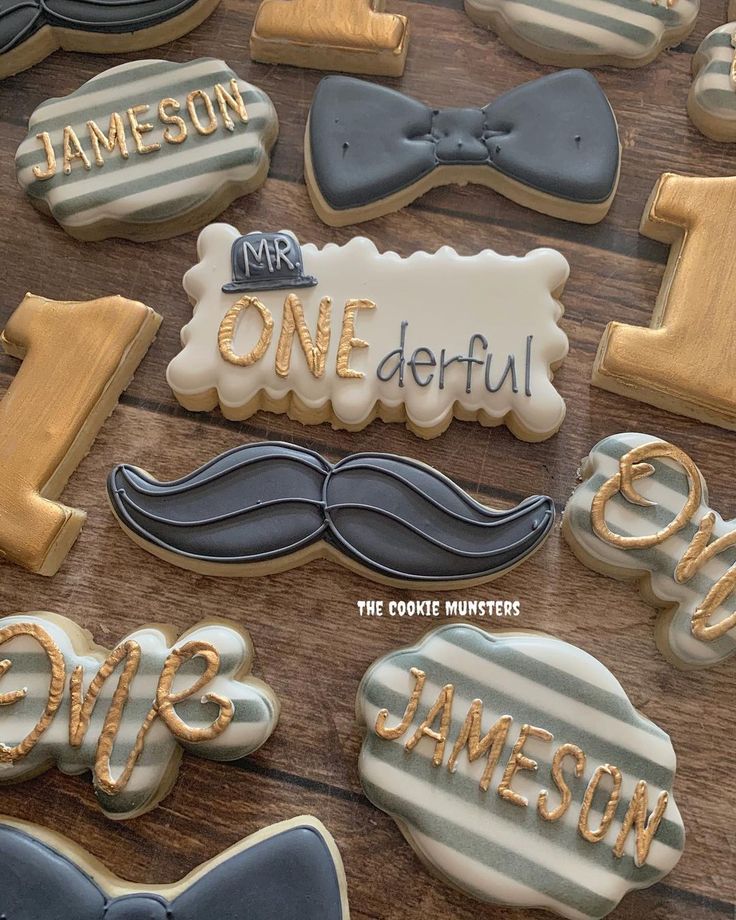 decorated cookies are arranged on a table with the words mr and mrs onederful