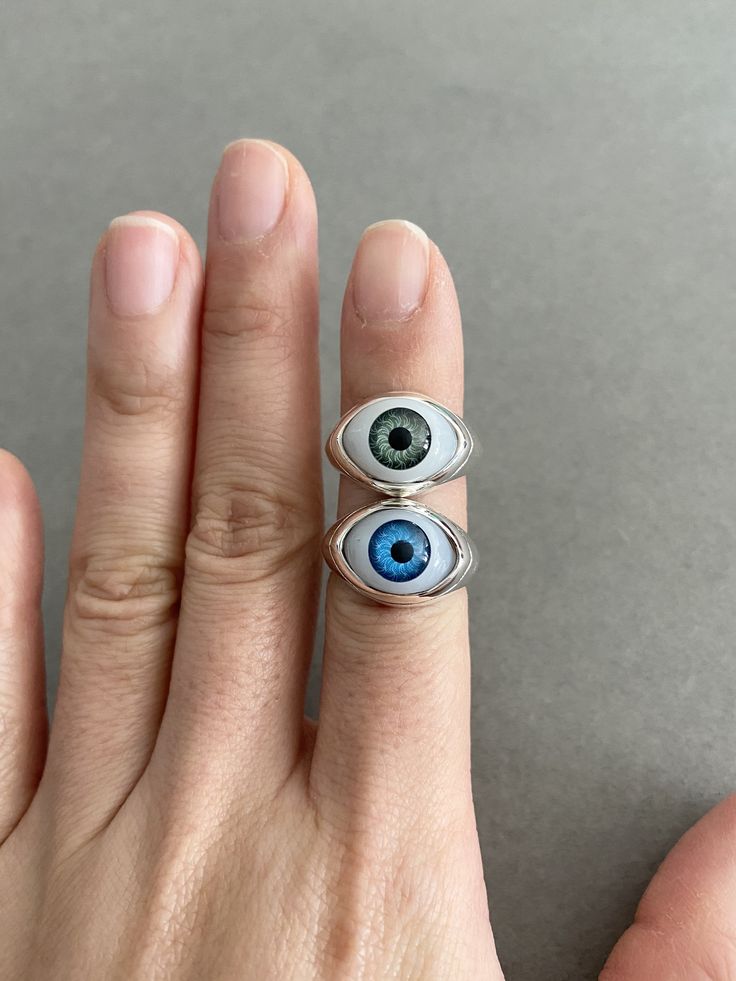 Sterling Silver Eye Rings - Sterling Silver ★ Quantity : One Ring ★ Color : Blue Eye / Green Eye ★ Material : Sterling Silver ★ Ring Size : 5 / 6 / 7 / 8 / 9 / 10 / 11 ★ Band Size : about 6mm wide and 1.5mm thick ★ Eye Size : 15mm*10mm ★ Comes in a jewelry box. If you need extra boxes for gifting....just let us know! Trendy Handmade Blue Ring, Trendy Handmade Blue Rings, Nickel Free Blue Metal Rings, Blue Open Ring Made Of Metal, Blue Open Ring Metal Ring, Nickel-free Blue Metal Rings, Blue Metal Open Ring, Blue Hypoallergenic Rings, Minimalist Nickel-free Blue Ring