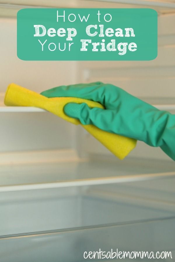 a person in rubber gloves cleaning an open refrigerator door with a sponge on it and the words how to deep clean your fridge