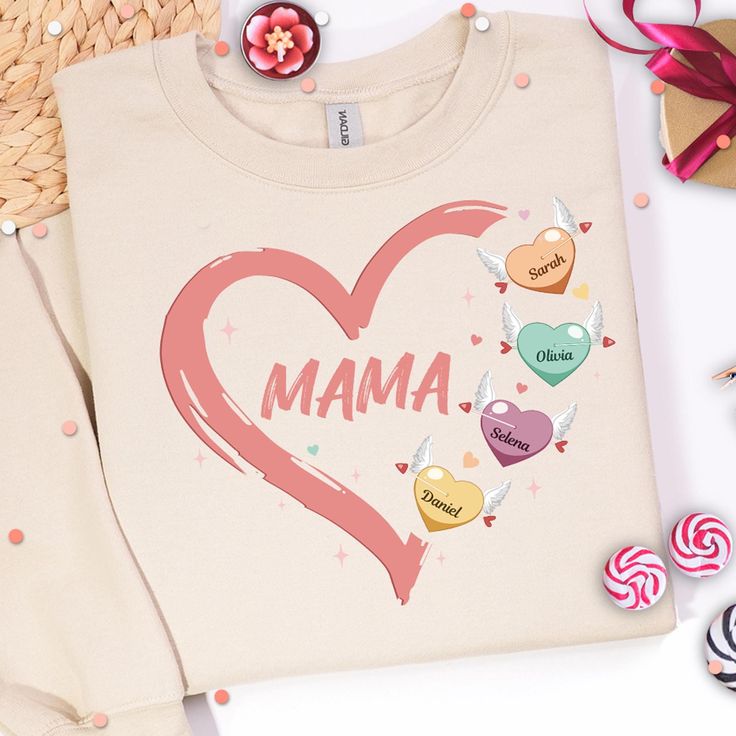 a sweater with the word mama on it next to candy candies and lollipops