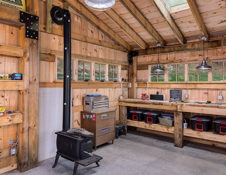 the inside of a garage with wood paneling