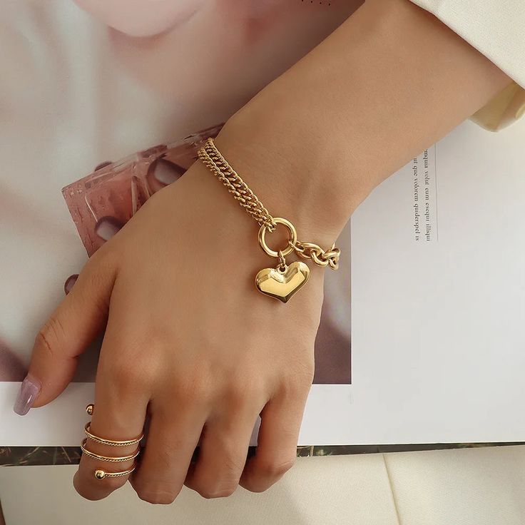 SPECIFICATIONSBrand Name: RamosGender: WomenMaterial: MetalMetals Type: STAINLESS STEELBracelets Type: Chain & Link BraceletsOrigin: Mainland ChinaCN: GuangdongChain Type: Link ChainItem Type: BRACELETSCompatibility: All CompatibleShape\pattern: HEARTModel Number: A-S236Setting Type: Bezel SettingFine or Fashion: fashionStyle: TRENDYFunction: Mood TrackerChoice: yessemi_Choice: yes●The material of the product is made of stainless steel.Will not fade after contact with water.Will not darken.Prevent allergies.●Apply to Occasion: Party, wedding ,engagement, gift for friend Mom sisters wife.●The package will not contain any information about our store and product prices.If you have any questions, please contact customer service. Elegant Bracelets For Mother's Day At Affordable Prices, Luxury Modern Name Bracelet For Everyday, Luxury Personalized Stainless Steel Jewelry, Luxury Gold Bracelets With Removable Charms, Cheap Gold Bracelet For Women As Gift, Elegant Heart Shaped Chain Bracelet, Jewelry Set For Mom, Luxury Personalized Gift Jewelry For Women, Affordable Elegant Chain Bracelet For Mother's Day