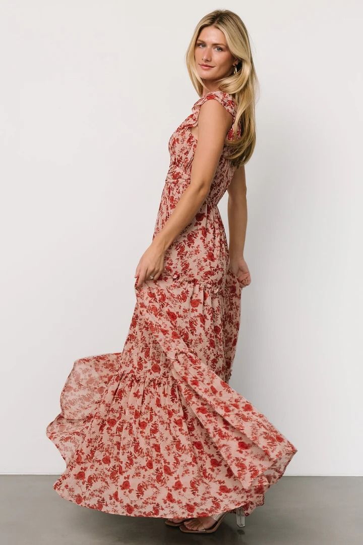 The Martina Maxi dress is a versatile semi-casual piece perfect for any occasion. Crafted in soft blush with deep red floral, its flowing chiffon material, wide V-neckline, and flutter sleeves offer both comfort and style, while the smocked back bodice and tiered skirt add flattering flair to this maxi-length beauty Red V-neck Chiffon Dress, Red Chiffon V-neck Maxi Dress, Red Flowy Chiffon Casual Dress, Red Chiffon V-neck Dress, Casual Red Chiffon Dress, Red Flowy V-neck Dress, Red Short Sleeve Feminine Maxi Dress, Feminine Red Short Sleeve Maxi Dress, Red Floral Maxi Chiffon Dress