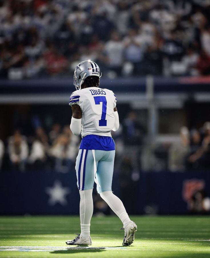 a football player is standing on the field