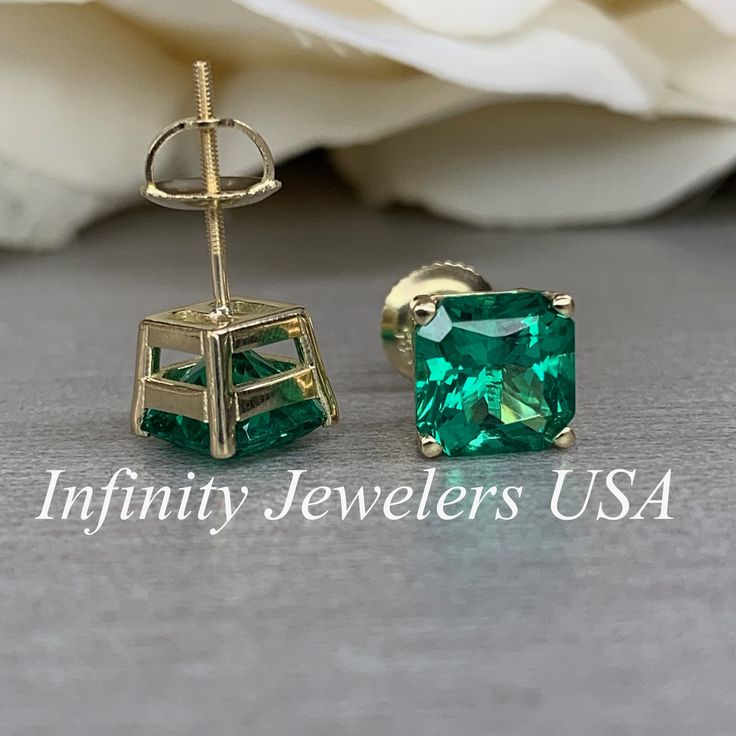 "These earrings are radiant cut lab created green emerald studs, 14k yellow gold #6228 -Approximate total carat weight: 3.50ctw diamond equivalent -Stone Size: approx. 1.75ct each diamond equivalent -Gem Type: emerald -Stone Shape: radiant cut 7x7mm each -Stone Clarity: VS2 -Stone Color: green -Moh's Scale: 8.5 Hardness -Metal Type and Purity: 14k yellow gold -Setting: 4 prong basketsetting -Backing: screw back (earring backs are subject to change due to availability) -Country of Manufacturing: Green Radiant Cut Jewelry For Anniversary, Fine Jewelry With Radiant Cut Green Gem, Emerald Green Earrings For Anniversary, Gia Certified Green Jewelry With Radiant Cut, Green Radiant Cut Fine Jewelry, Classic Green Diamond Cut Earrings, Emerald Cut Green Gemstone Earrings, Fine Jewelry Emerald Cut May Birthstone Earrings, Fine Jewelry Emerald Cut Earrings For May Birthstone